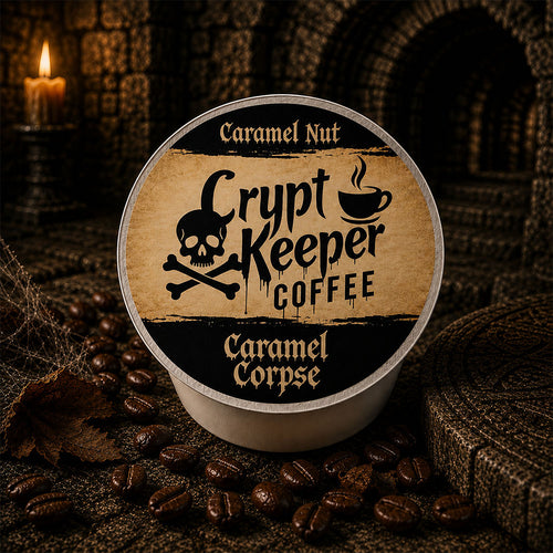 A single round coffee pod package labeled 'Crypt Keeper Coffee' and 'Caramel Nut' sits on a dark textured surface surrounded by coffee beans, with a candle and stone archway in the background.